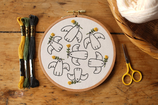Birds of a Feather embroidery kit by Twin Folk – beginner-friendly peace birds embroidery project with pre-printed fabric and DMC floss.
